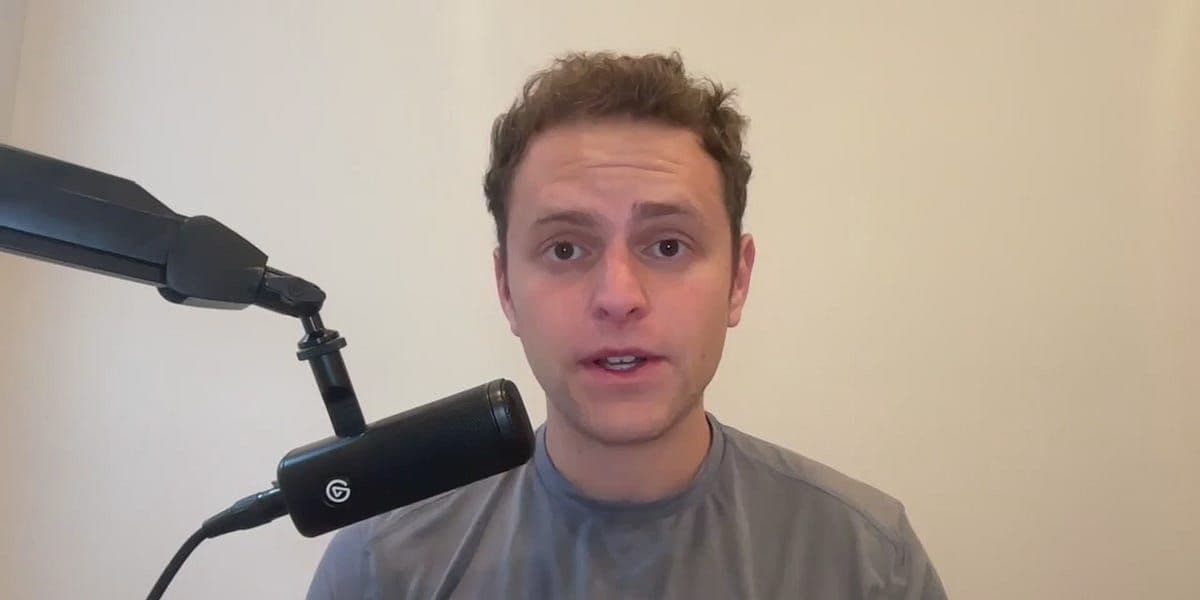 Donald Trump speaking, with broadcast network logos representing threatened media companies in the background